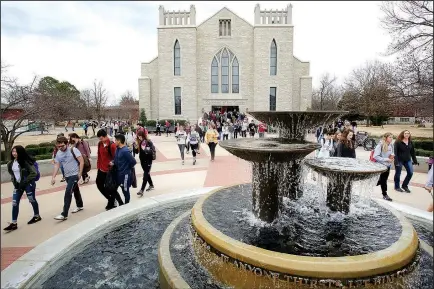  ?? NWA Democrat-Gazette/DAVID GOTTSCHALK ?? Students leave the Cathedral of the Ozarks on the campus of John Brown University in Siloam Springs.