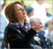  ?? PETE BANNAN — DIGITAL FIRST MEDIA ?? Diane Pluff of Newtown Square prays at the local National Day of Prayer service held at Rose Tree Park.