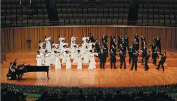  ?? PROVIDED TO CHINA DAILY Black Cat Detective, ?? The in-house chorus of the National Center for the Performing Arts performs during a music festival in Beijing in August. The video of its rendition of the theme song of the cartoon series, has attracted more than 5 million views online.