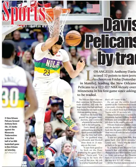  ??  ?? New Orleans Pelicans forward Anthony Davis (No. 23) dunks against the Minnesota Timberwolv­es in the first half of an NBA basketball game in New Orleans on Saturday.