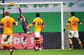  ??  ?? Scott Bain is beaten by the deflected shot from Allan Campbell