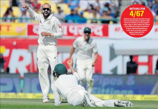  ?? AP ?? Australia offspinner Nathan Lyon celebrates the dismissal of India's Cheteshwar Pujara. Lyon ended Day 2 with four wickets.