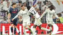  ?? (Reuters) ?? Real Madrid’s Federico Valverde (second left) celebrates after scoring against Manchester City at the Santiago Bernabeu in Madrid.