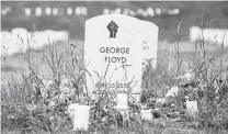  ?? Nicholas Pfosi / Bloomberg ?? A symbolic headstone for George Floyd stands at the “Say Their Names Cemetery” in Minneapoli­s on Thursday.