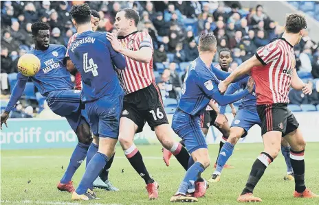  ??  ?? Sunderland skipper John O’Shea gets forward to put the pressure on in a rare foray into the Cardiff box. Pictures by Frank Reid.