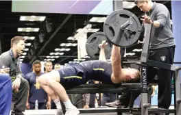  ??  ?? Adam Shaheen works out at the NFL Scouting Combine in March in Indianapol­is. The 6- 6, 278- pound tight end dominated his Division- II conference at Ashland. The Bears drafted him in the second round.
| GREGORY PAYAN/ AP ( ABOVE), ASHLAND UNIVERSITY...