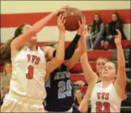  ??  ?? VVS sophomores Morgan Brewer (3) and Anna Rossi (23) contend with CVA senior Abby Brown (20) for a rebound during Class B sectional play on Friday, Feb. 15.