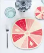  ??  ?? Citrus slice design placemat – pink grapefruit beyond the fridge, £12