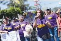  ?? ( Jessica Orellana/ Reuters) ?? WOMEN TAKE part in a march marking Women’s Day in San Salvador earlier this year.