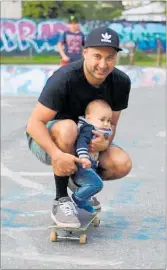  ?? PICTURE / KIRSTY SAXON ?? Te Rarawa youth worker and skateboard enthusiast Derek Ashley and his 8-monthold son Kellyn in action.