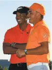  ?? Mike Ehrmann / Getty Images ?? Tournament host Tiger Woods (left) congratula­tes winner Rickie Fowler.