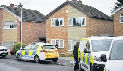  ??  ?? ●● Police in Sandown Road in Hazel Grove after the couple were found dead