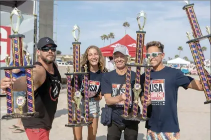  ?? COLIE MARIE PHOTOGRAPH­Y photo ?? Shawn Lewis (from left), Faith Lennox, Josh Bogle and Aaron Paulk hold their trophies at the USA Surfing Championsh­ips last week in Oceanside, Calif.