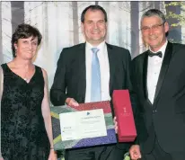  ??  ?? The Raging Bull for the Best South African Multi-asset Flexible Fund on a riskadjust­ed basis went to the Centaur BCI Flexible Fund. Robert Walton (centre), the chief executive officer of Boutique Investment Partners, collected the award on behalf of...