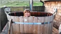  ??  ?? HIGH LIFE: Inside the treehouse, left, and Wendy, above, settles into the trendy ‘Luv Tub’