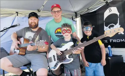  ?? Picture: PAUL CARRACHER ?? SHOW OF FORCE: From left, ‘The Bloke From Goroke’ Ross Mueller and Matt Polack make music with Seth Rolins-winfield and his friend Eli Mclean at a Seth’s Force Community Family Fun Day in Horsham.