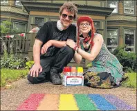  ?? MILLICENT MCKAY/JOURNAL PIONEER ?? Andrew Birch, left, and Meaghan Roberts with their finished rainbow on the porch step of a Summerside home. The duo has been spray-painting rainbows on porches and driveways to encourage acceptance in Summerside.