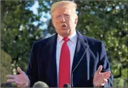  ?? / Ap-Alex Brandon ?? President Donald Trump as he walks to Marine One in Washington on Sunday. Trump is en route to Camp David.