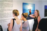  ?? PROVIDED TO CHINA DAILY ?? Visitors at the ongoing art shows at the Danish Cultural Center in Beijing’s 798 art zone.