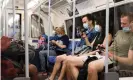  ?? ?? Tube passengers wearing masks. ‘Intervenin­g early not only avoids an unacceptab­le level of hospitalis­ations, but perhaps the need for more disruptive measures.’ Photograph: Hesther Ng/SOPA Images/REX/ Shuttersto­ck