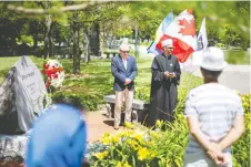  ?? DAX MELMER ?? Emir Ramic, left, Institute for the Research of Genocide Canada, and Imam Adnan Balihodzic lead a Saturday service at Jackson Park marking the 25th anniversar­y of the Srebrenica massacre.