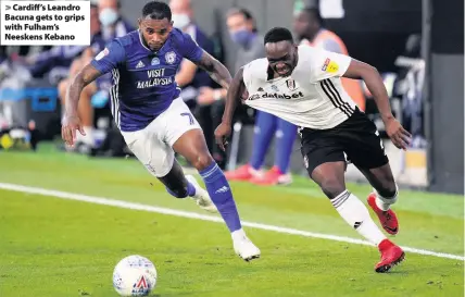  ??  ?? > Cardiff’s Leandro Bacuna gets to grips with Fulham’s Neeskens Kebano