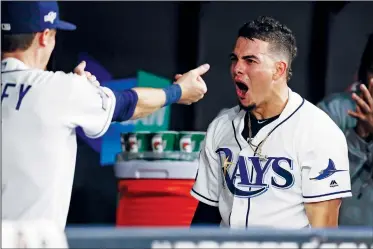  ?? AP/CHRIS O’MEARA ?? Tampa Bay’s Willy Adames (right) celebrates his solo home run against the Houston Astros on Tuesday during the fourth inning of Game 4 of an American League Division Series in St. Petersburg, Fla.