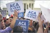  ?? DOUG MILLS — THE NEW YORK TIMES ?? Supporters of the Affordable Care Act rally outside the Supreme Court in Washington after a ruling that upheld a major provision of the law on June 25, 2015.