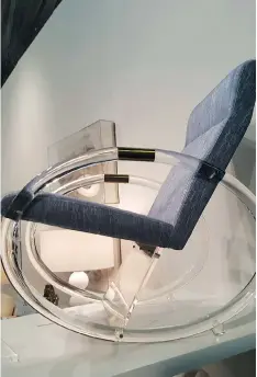  ?? KIM COOK/THE ASSOCIATED PRESS ?? Scout Studio showcases a reinterpre­ted rocking chair with modern acrylic and brass hoop arms.