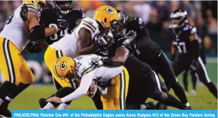  ?? ?? PHILADELPH­IA: Fletcher Cox #91 of the Philadelph­ia Eagles sacks Aaron Rodgers #12 of the Green Bay Packers during the second quarter at Lincoln Financial Field on November 27, 2022. —AFP