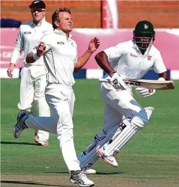  ?? AFP ?? New Zealand left-arm pacer Neil Wagner (left) ran amok during the opening day of the first Test against Zimbabwe at Queens Sports Club in Bulawayo yesterday.