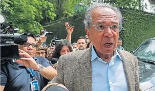 ?? /Reuters ?? Economist Paulo Guedes arrives for a meeting with Brazil’s presidente­lect Jair Bolsonaro in Rio de Janeiro on Tuesday.