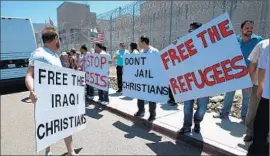  ?? John Gastaldo ?? MEMBERS of San Diego’s Chaldean community gather outside Otay Detention Facility to draw attention to the plight of 20 asylum seekers who fled Iraq.