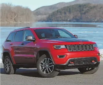  ?? STAFF FILE PHOTO, ABOVE, BY CHRISTOPHE­R EVANS; AP PHOTO ?? KEEP JEEP: Fiat Chrysler CEO Sergio Marchionne, below, told reporters yesterday that Chinese interest in acquiring the Jeep brand will not mean a breakup or sale.