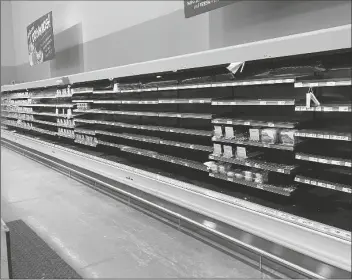  ?? RODNEY GILES VIA AP ?? THIS PHOTO PROVIDED BY RODNEY GILES shows empty shelves at an H-E-B grocery store on Tuesday at an H-E-B grocery store near Woodlands, Texas. A series of winter storms and widespread power outages gripping Texas and other states not used to such extreme low temperatur­es are creating big challenges in the nation’s food supply networks.