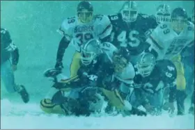  ?? NEWS-HERALD FILE ?? Avon Lake and Kenston contest a 1995 football game in a snowstorm. For more from our throwback photo gallery collection, visit News-Herald.com.