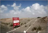  ?? NARIMAN EL-MOFTY ?? This Feb. 15, , photo shows a sign with Arabic that reads, “danger mines, danger mines” on the highway from Abyan to Aden in Yemen.