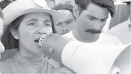  ?? COURTESY OF 1976 GEORGE BALLIS/TAKE STOCK/THE IMAGE WORKS ?? United Farm Workers leader Dolores Huerta organizes marchers on the second day of March Coachella in Coachella, Calif., in 1969.