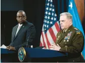  ?? ALEX BRANDON/AP ?? Pentagon chief Lloyd Austin, left, and Joint Chiefs Chairman Gen. Mark Milley talk to the media after a virtual meeting with defense leaders from around the world.