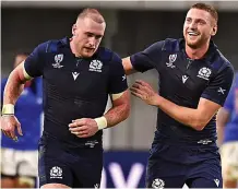  ??  ?? Tartan terrors: Star men Hogg (left) and Russell will likely be heading for South Africa with the Lions next year