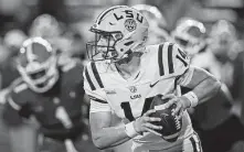  ?? John Raoux / Associated Press ?? Max Johnson is LSU’s starting quarterbac­k for now, but highly touted freshman Garrett Nussmeier is waiting in the wings.