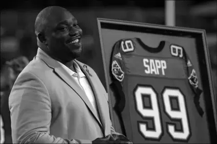  ?? AP Photo/Phelan M. Ebenhack ?? In this 2013 file photo, former Tampa Bay Buccaneers player Warren Sapp smiles after being inducted in the Ring of Honor ceremony during halftime in an NFL football game between the Tampa Bay Buccaneers and the Miami Dolphins in Tampa, Fla.