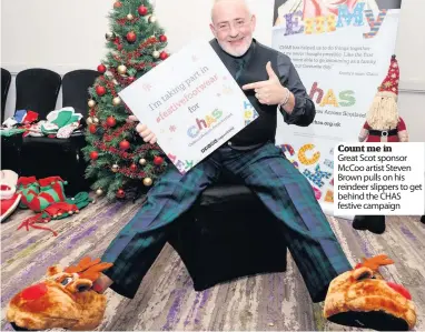  ??  ?? Count me in Great Scot sponsor Mccoo artist Steven Brown pulls on his reindeer slippers to get behind the CHAS festive campaign