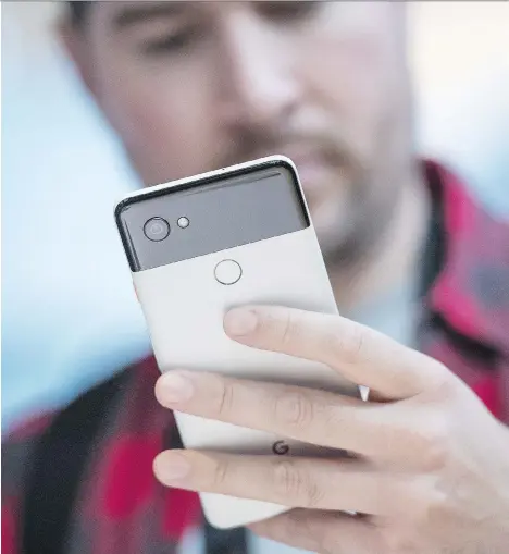  ?? DAVID PAUL MORRIS/BLOOMBERG ?? Google unveiled its new smartphone­s, Pixel 2 and Pixel 2 XL, pictured, on Wednesday during a keynote in Mountain View, Calif. Its devices borrow from Apple’s playbook, but also introduces new features through its integrated hardware, software and AI.