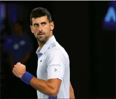  ?? (AP/Asanka Brendon Ratnayake) ?? Novak Djokovic of Serbia reacts Sunday after defeating Adrian Mannarino of France 6-0, 6-0, 6-3 in their fourth round match of the Australian Open at Melbourne Park in Melbourne, Australia. Djokovic reached the quarterfin­al of a Grand Slam for the 58th time, matching Roger Federer’s record.