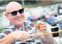  ?? Haslingden pictures: Dominic Salter ?? ●● Graeme Clarke enjoys a tipple at Haslingden Cricket Club beer festival and revellers having fun. Right: Visitors at Helmshore Beer Festival