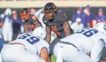  ?? SPORTS] ?? OSU linebacker Amen Ogbongbemi­ga (11) is one of the team's senior players who has been socially active. [BRETT ROJO/USA TODAY