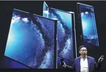  ?? SERGIO PEREZ / REUTERS ?? Yu Chengdong, CEO of Huawei’s consumer business group, unveils Mate X, a foldable 5G-ready smartphone, in Barcelona, Spain, on Sunday.
