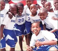  ?? Contribute­d photo ?? Children in the Khayelitsh­a neighborho­od of Cape Town, South Africa, wearing their uniforms donated by the Nonnewaug athletic department.