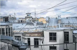  ??  ?? THE VIEW from the rooftop of a communal apartment building. “It’s not ideal; I’d like more quiet,” a resident of the building says. “But I get to live in the historical center and experience the city.”